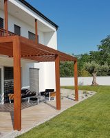 Pergola on passive house with large panoramic windows