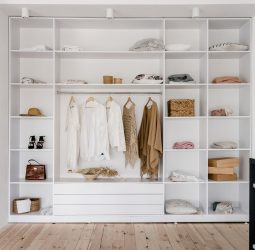 modern and large wardrobe in dressing room with